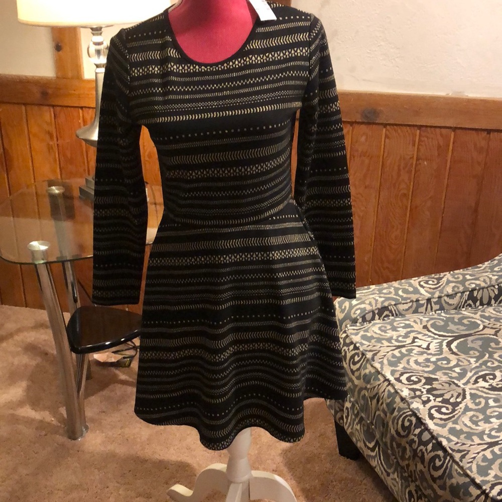 Black and gold children’s place dress tags on